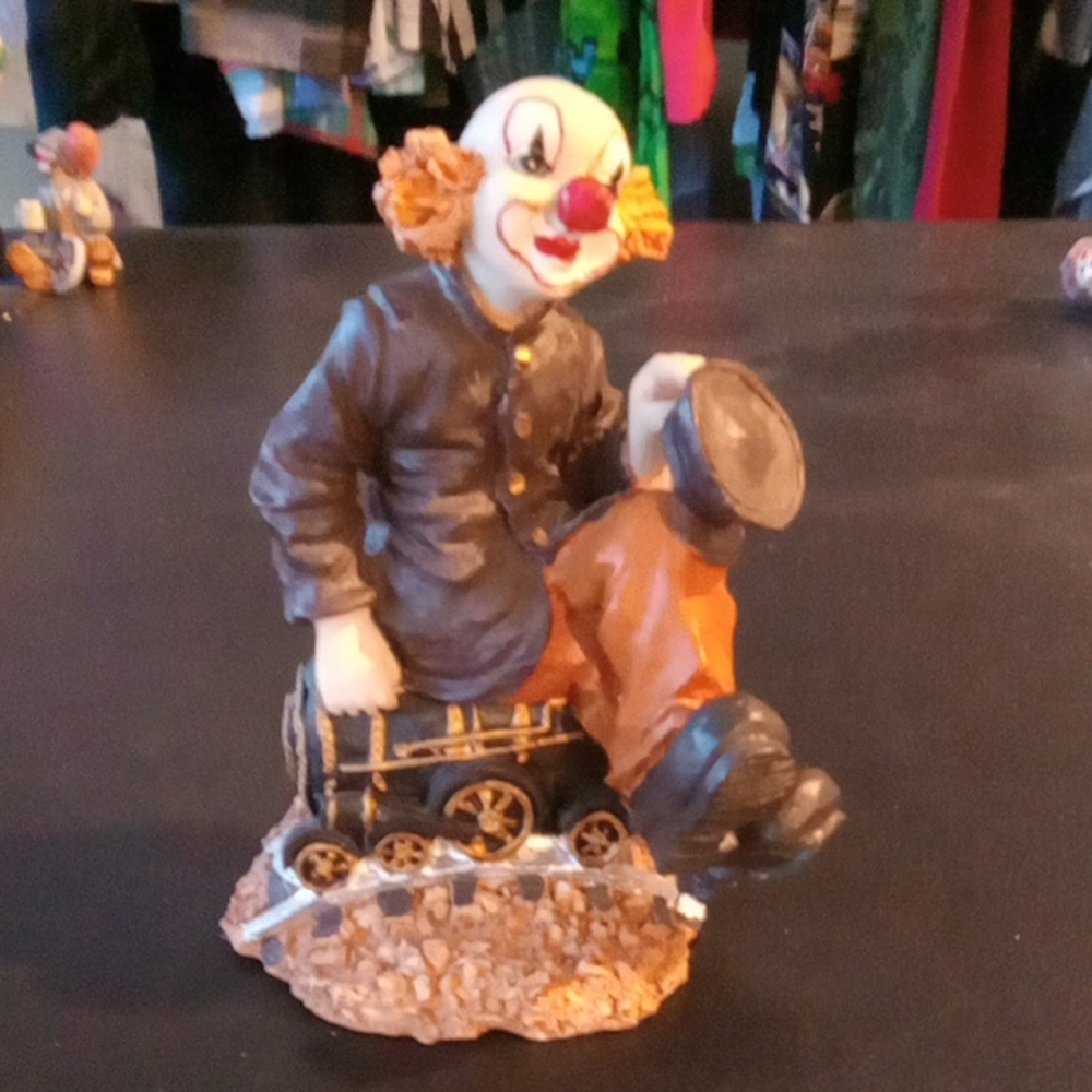 Large Clown Figurine On A Train